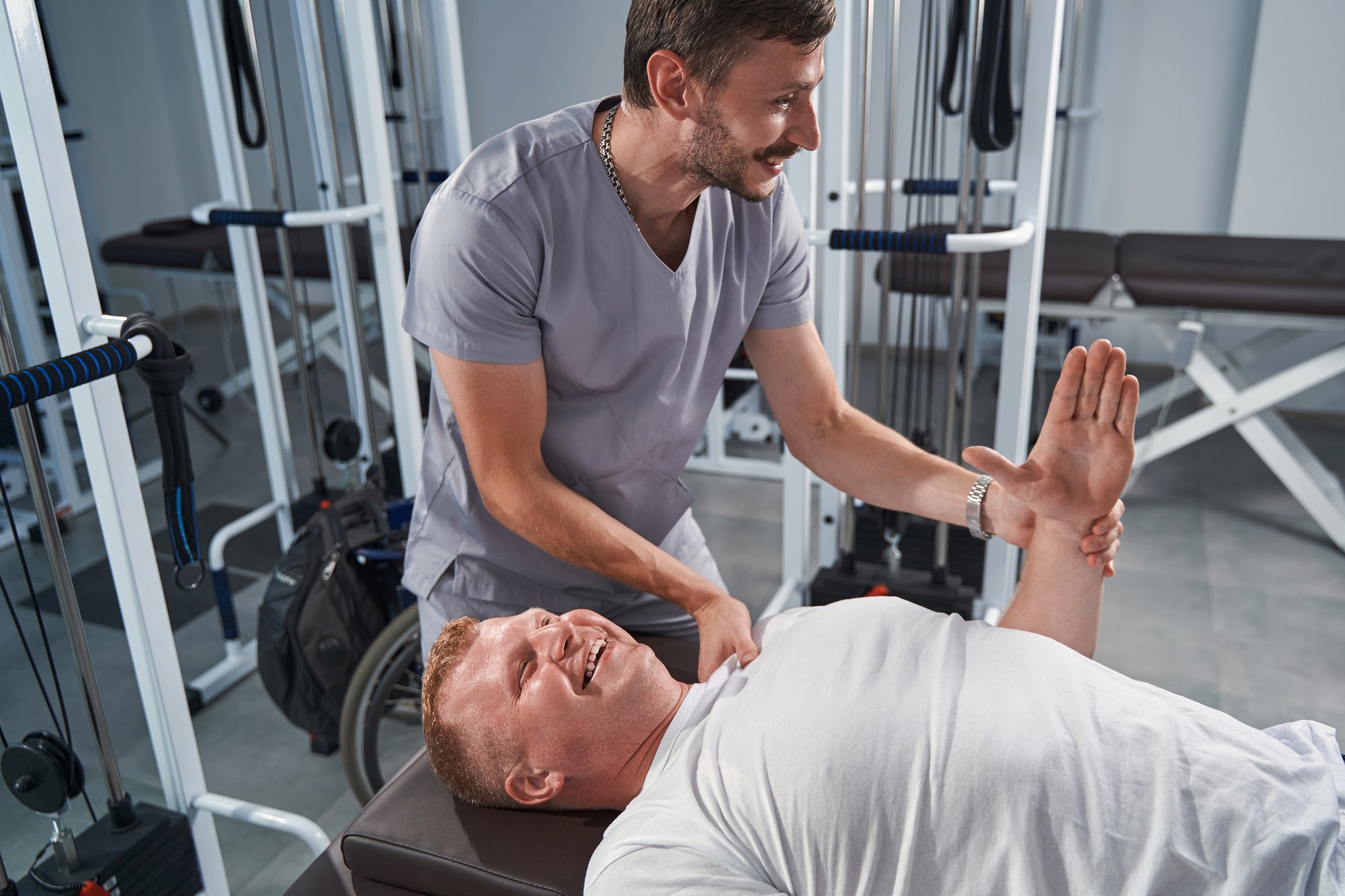 man-therapist-treats-patient-hand-on-massage-table-2024-10-20-09-58-07-utc